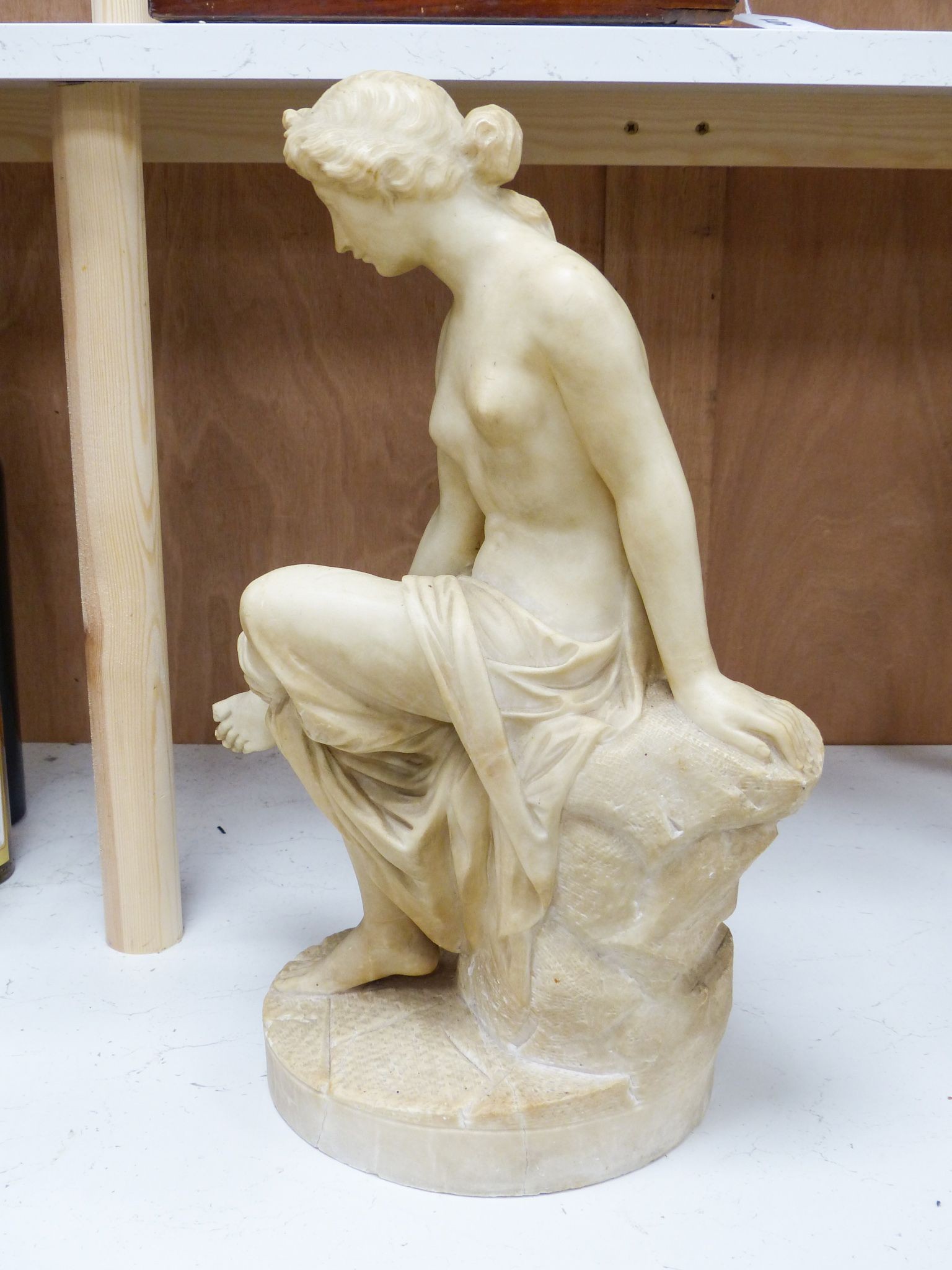 A 19th century Italian carved alabaster figure of a seated lady after the Antique, 45cm